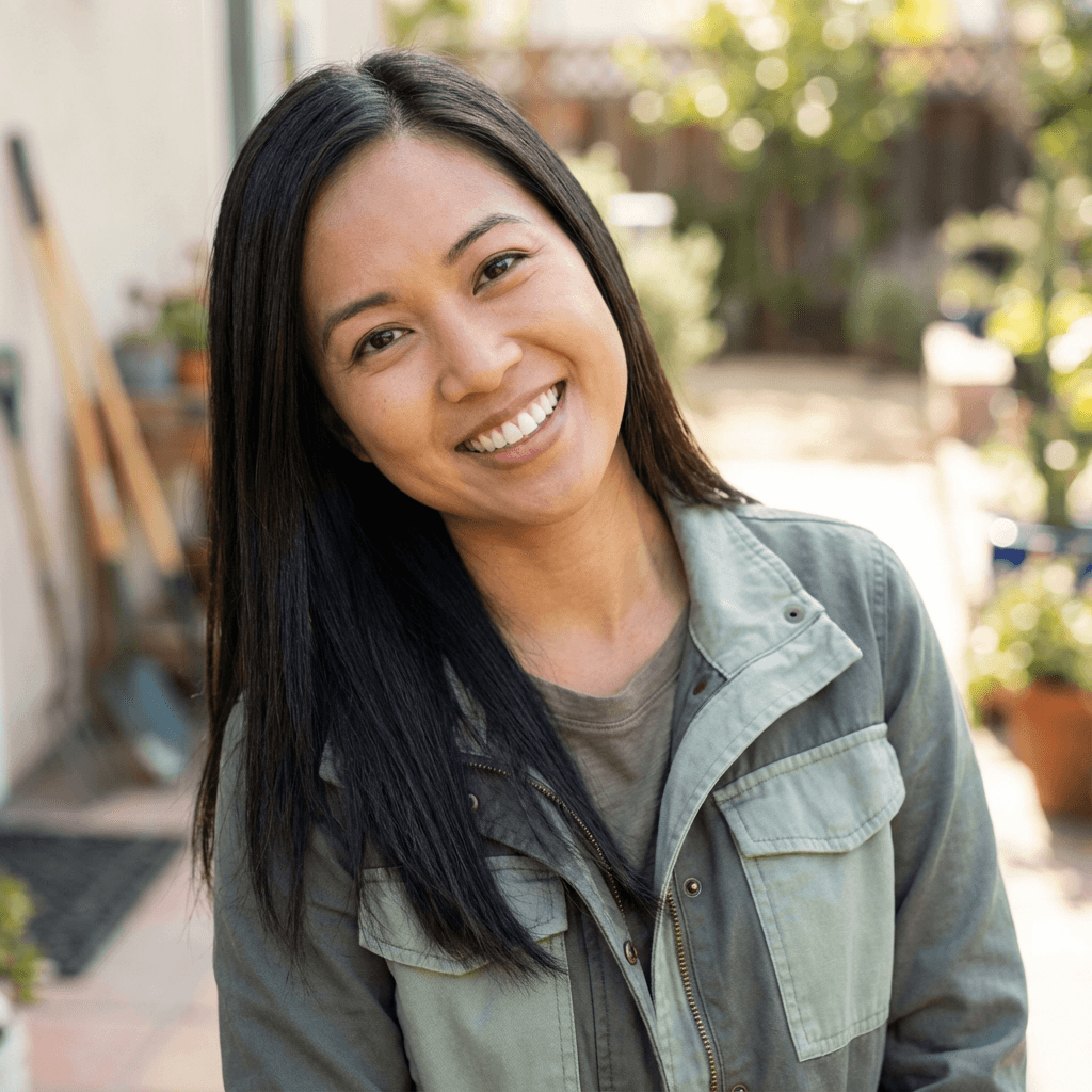 Female business strategist in her early 30s, East Asian, professional and approachable appearance